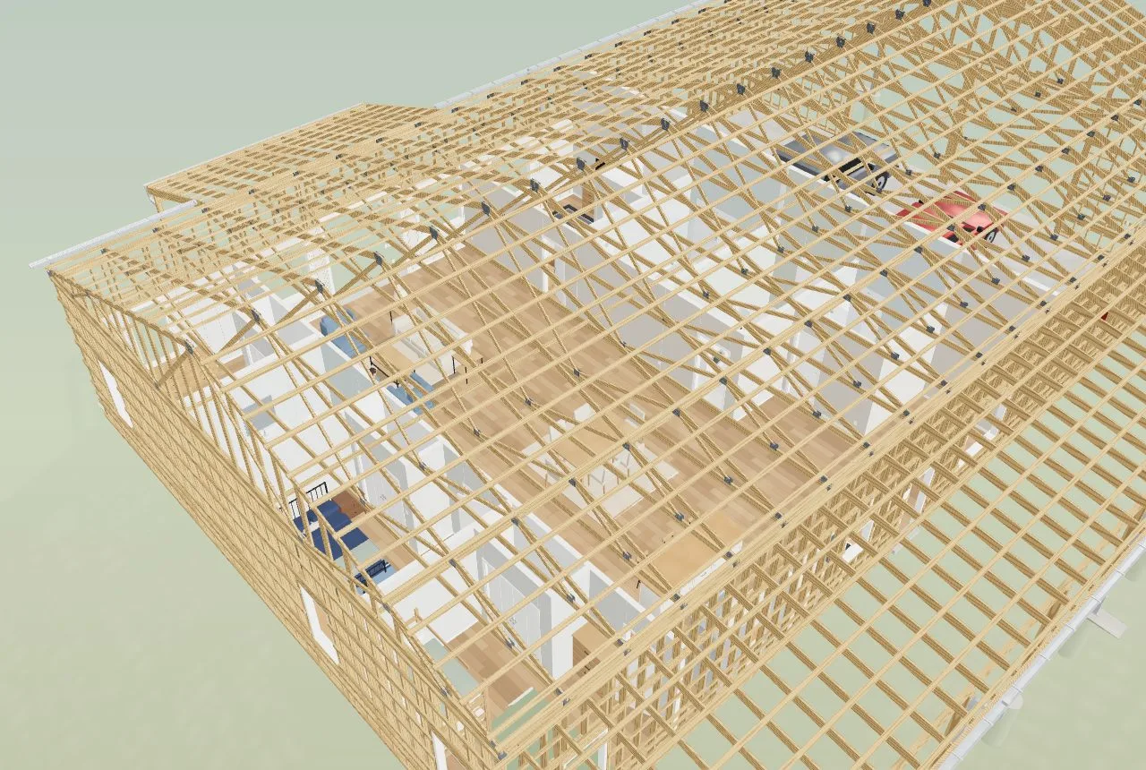 A furnished 50 by 80 shouse in Frame view: every truss, girt and stud drawn over the staged rooms, and the builder still turns smoothly
