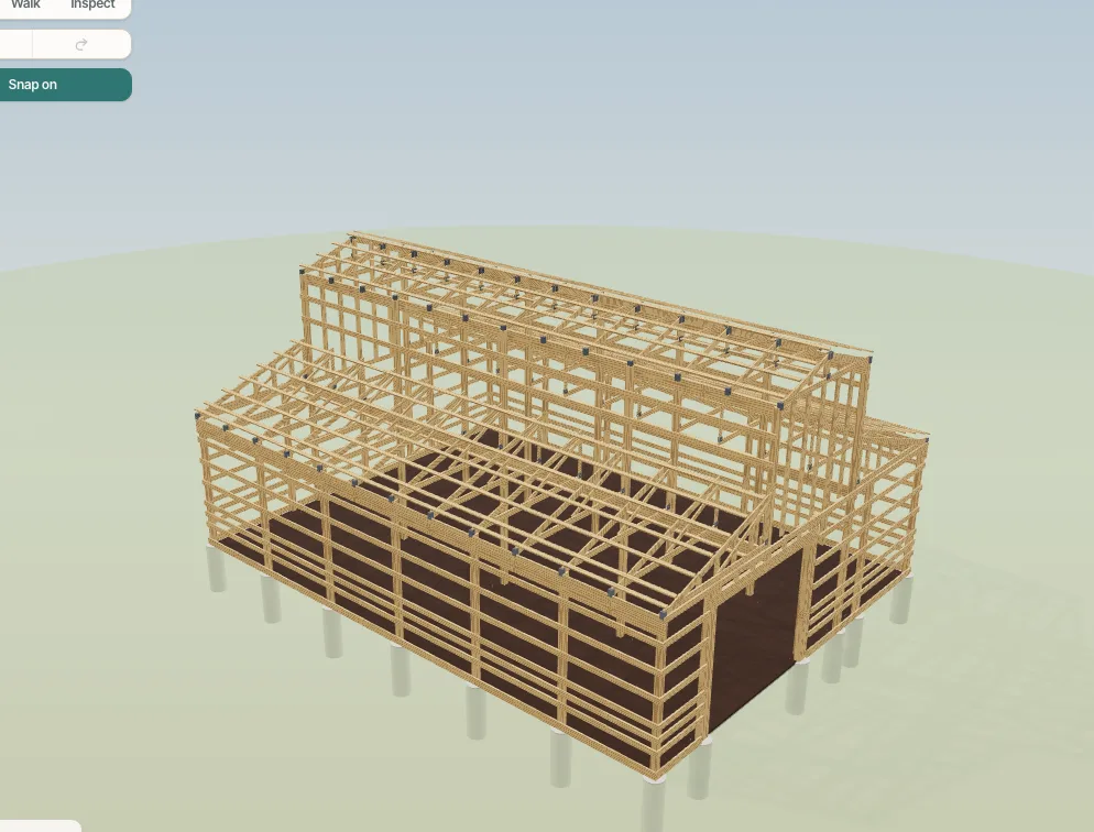 A monitor barn in frame view: wing trusses ending at the column rows, the centre trusses on their carriers